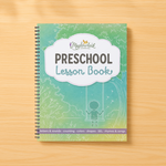 Preschool lesson book on a wooden surface