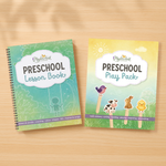 Two preschool educational books on a wooden surface